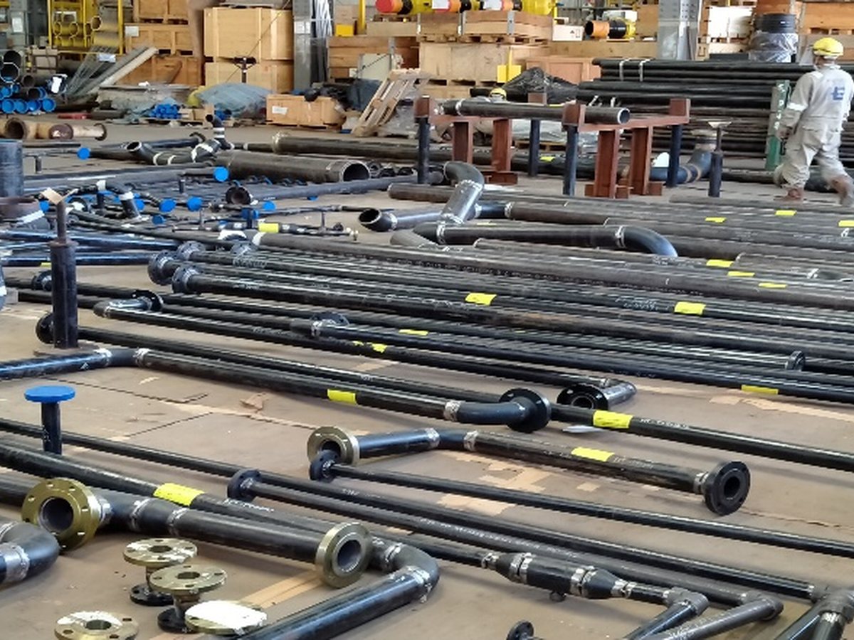 Long pipe runs and branch fittings on the workshop floor