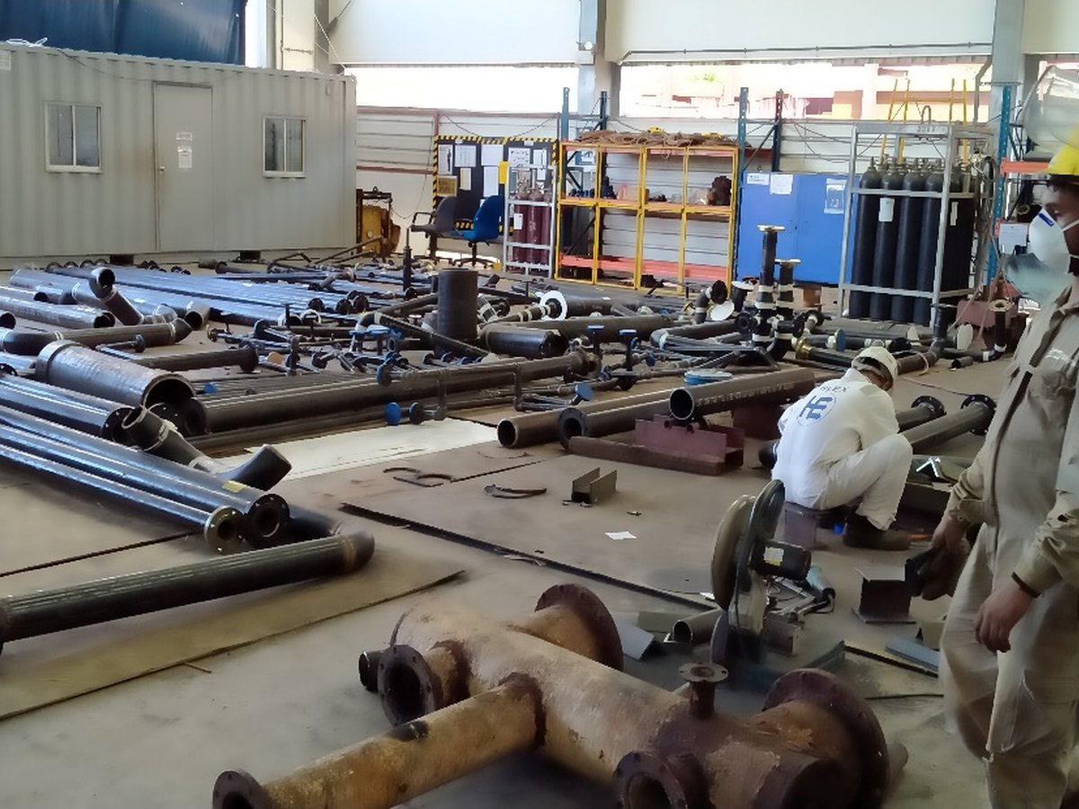 Spool fabrication in progress with cutting and fit-up work